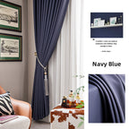 Navy blue blackout curtains in a modern interior